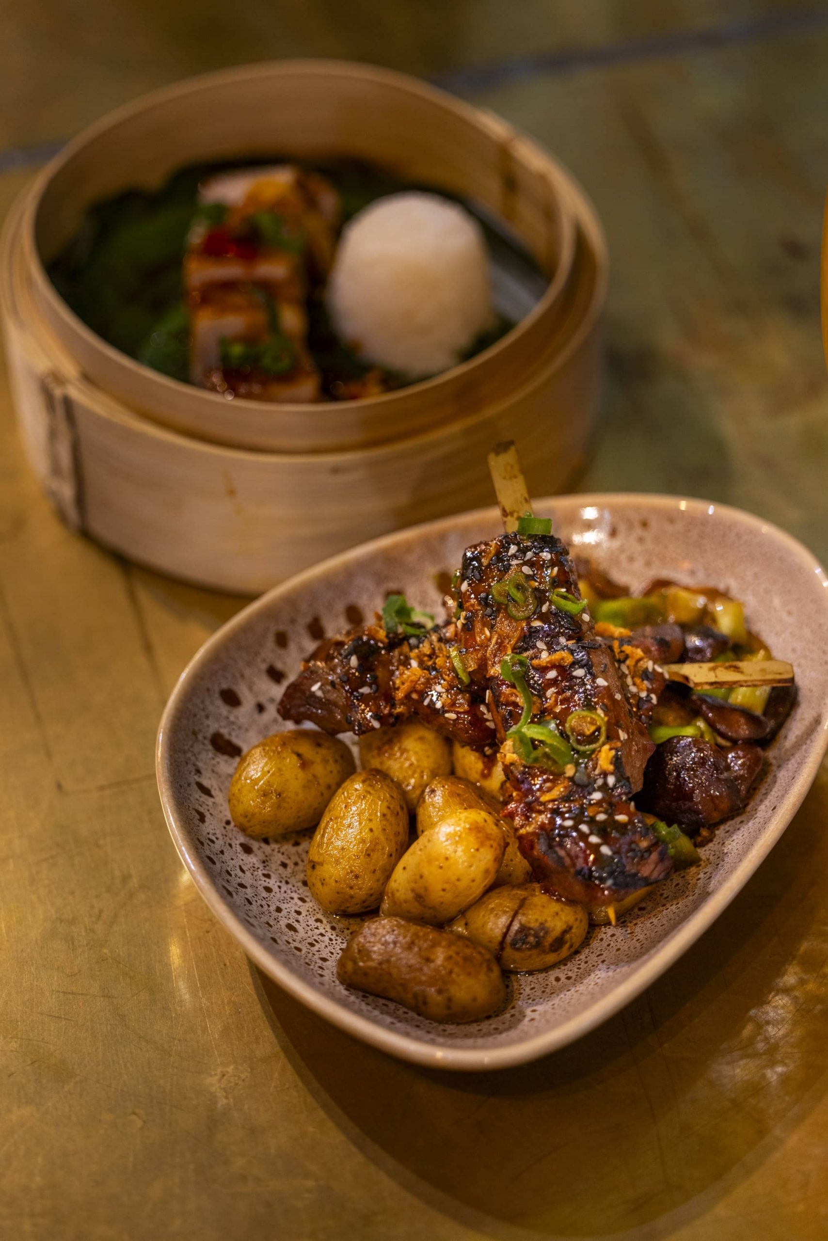nhow_Rotterdam_Restaurant_interior_beef_skewers_in_front_of_pork_belly
